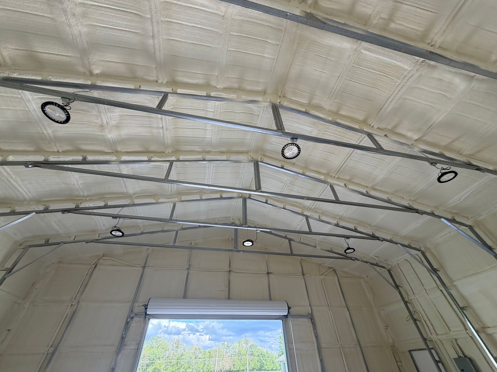 Foam across the roof panels, between the steel frames.