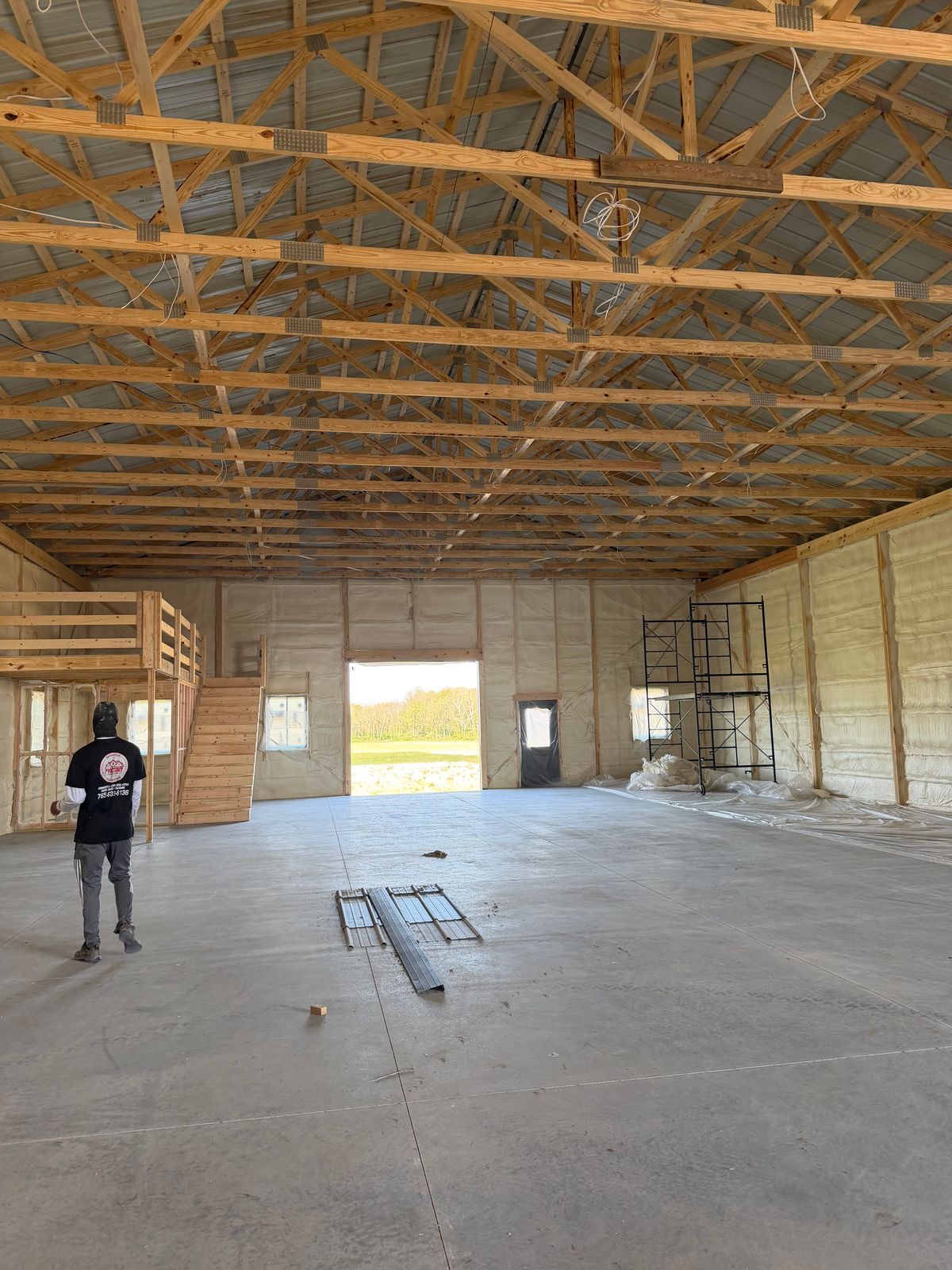The length of the barn addition, with the walls foamed.
