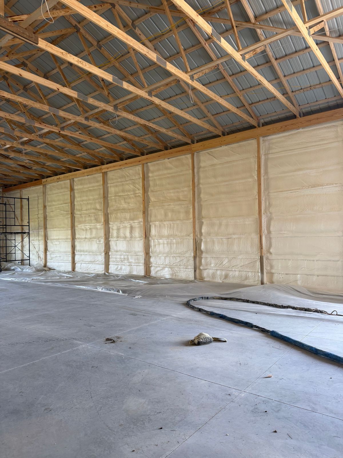 Foamed walls along the far side of the barn.