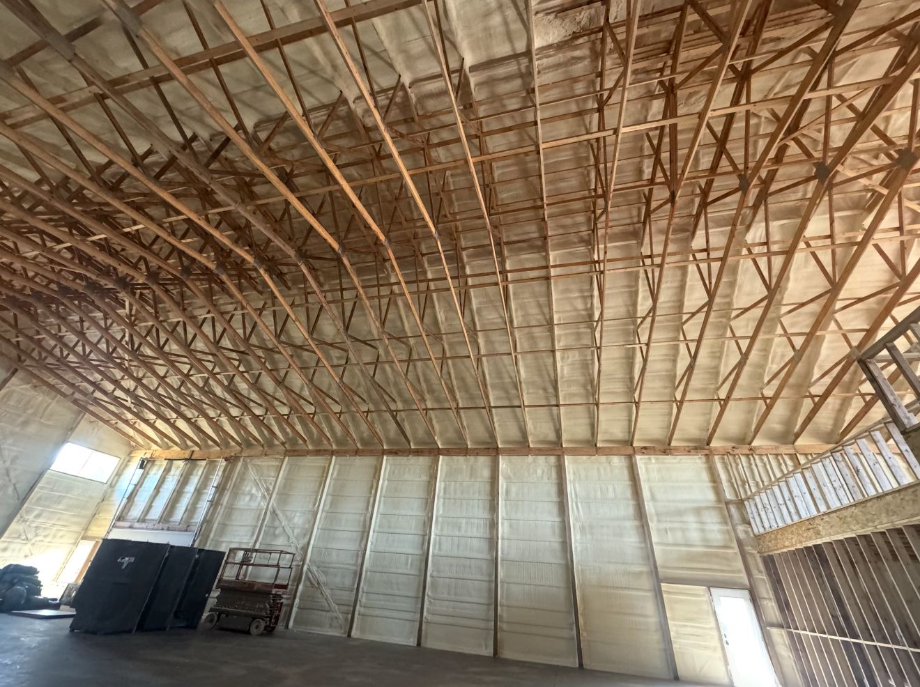 Inside, with the walls and roof foamed before the interior is finished.